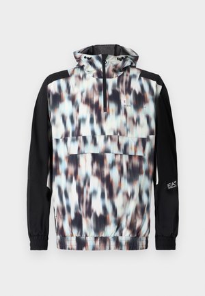 Colorful windbreaker jacket featuring a blurred abstract pattern in shades of blue, peach, and black, with a half-zip and elastic cuffs.