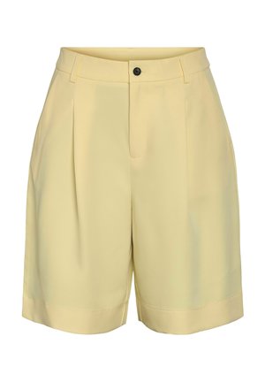 Világos sárga, magas derekú, szabott rövidnadrág elülső pliszírozással, övbújtatókkal, fekete gombbal és rejtett cipzáras záródással.