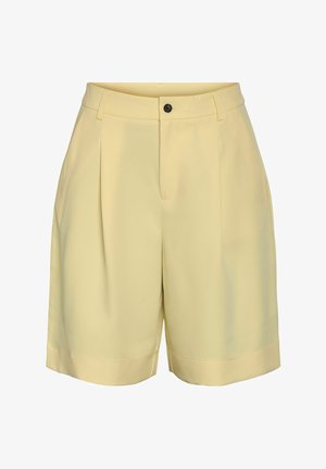 High waist, lichtgele, op maat gemaakte korte broek met plooien aan de voorkant, riemlussen, een zwarte knoop en een verborgen rits.