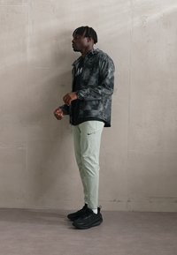 Nike Performance FLEX REP - Tepláky - jade horizon