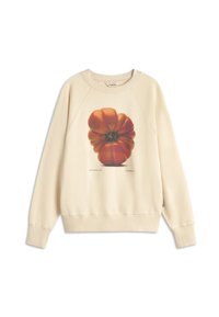 Cream sweatshirt featuring a large graphic of a red-orange tomato on the front. Ribbed cuffs and hem, with a relaxed fit and soft texture.