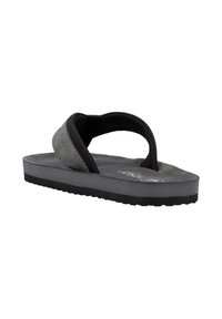 Gray flip-flop made of soft suede with a black rubber sole, featuring a thong strap design and textured footbed for comfort.