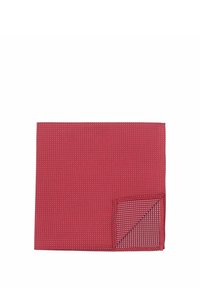 Red textile with a textured pattern featuring small white dots, edged with a contrasting checkered fold at one corner.