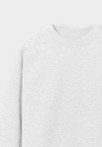 Light gray crewneck sweatshirt fabric texture with ribbed collar and shoulder seam visible on a plain background.