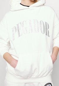 Pegador Jersey con capucha - white