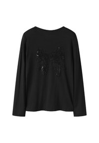 Schwarzes langärmliges Hemd mit einem großen schwarzen Pailletten-Schleifendesign auf der Rückseite, dargestellt vor weißem Hintergrund.