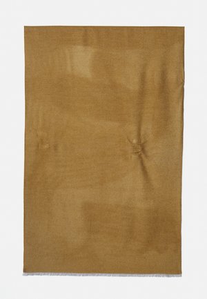 Tapis rectangulaire uni couleur chameau avec une texture douce et des bords frangés blancs sur un fond blanc uni.