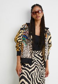 adidas Originals ADIDAS FARM RIO FIREBIRD TRACK - Treningsjakke - crystal sand