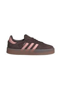 Low-top Adidas Samba sneaker in dark brown suede with pale pink stripes and gum rubber sole, side view on white background.