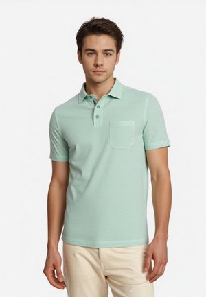 Mint green polo shirt made of textured fabric, featuring a collar, two buttons, and a chest pocket. Short sleeves and fitted design.