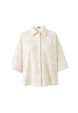 Cremefarbenes Hemd zum Zumknöpfen mit weiten dreiviertel Ärmeln, einer Brusttasche und einem dezenten, floralen Präge-Muster.