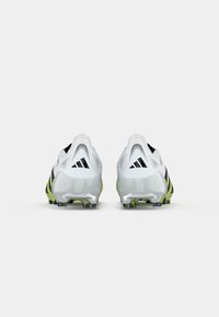Pair of white and silver Adidas soccer cleats with black logos viewed from the back on a plain white background.