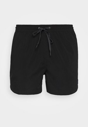 Bañador negro con cintura elástica, cordón ajustable y una textura suave. Sin patrones ni herrajes visibles.