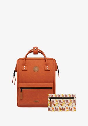 Orange leather backpack with a structured design, top handle, front zipper pocket, and a detachable patterned pouch featuring flowers and animals.