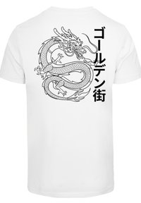 White t-shirt featuring a black outlined dragon design on the back, with Japanese text to the left in vertical alignment.