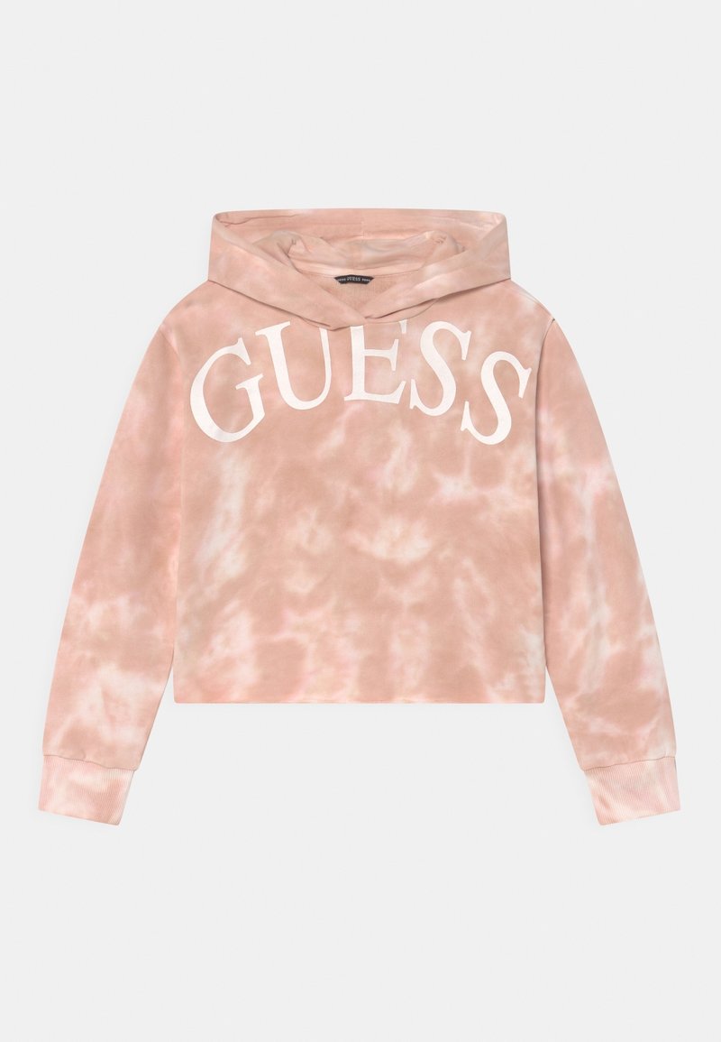 Haut à capuche court en tie-dye rose avec un grand logo blanc "GUESS". Dispose d'une capuche avec cordon de serrage et de poignets côtelés. Texture de tissu douce.