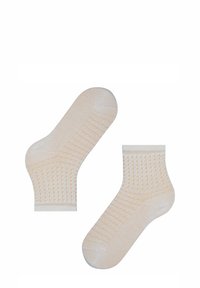 Beige enkelsokken met een textuurpatroon, voorzien van contrasterende lichtoranje stippen, witte boorden en een soepele, gebreide stof.