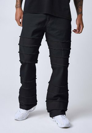 À DÉTAILS EFFILOCHÉS - Jean boyfriend - noir