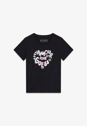 Black t-shirt made from organic cotton featuring a heart-shaped graphic with the words "AMOUR POUR GUESS," in various colors and fonts.