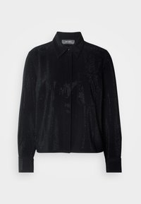 Chemise noire à manches longues avec boutons, col pointu, poche poitrine et texture de tissu perforé.