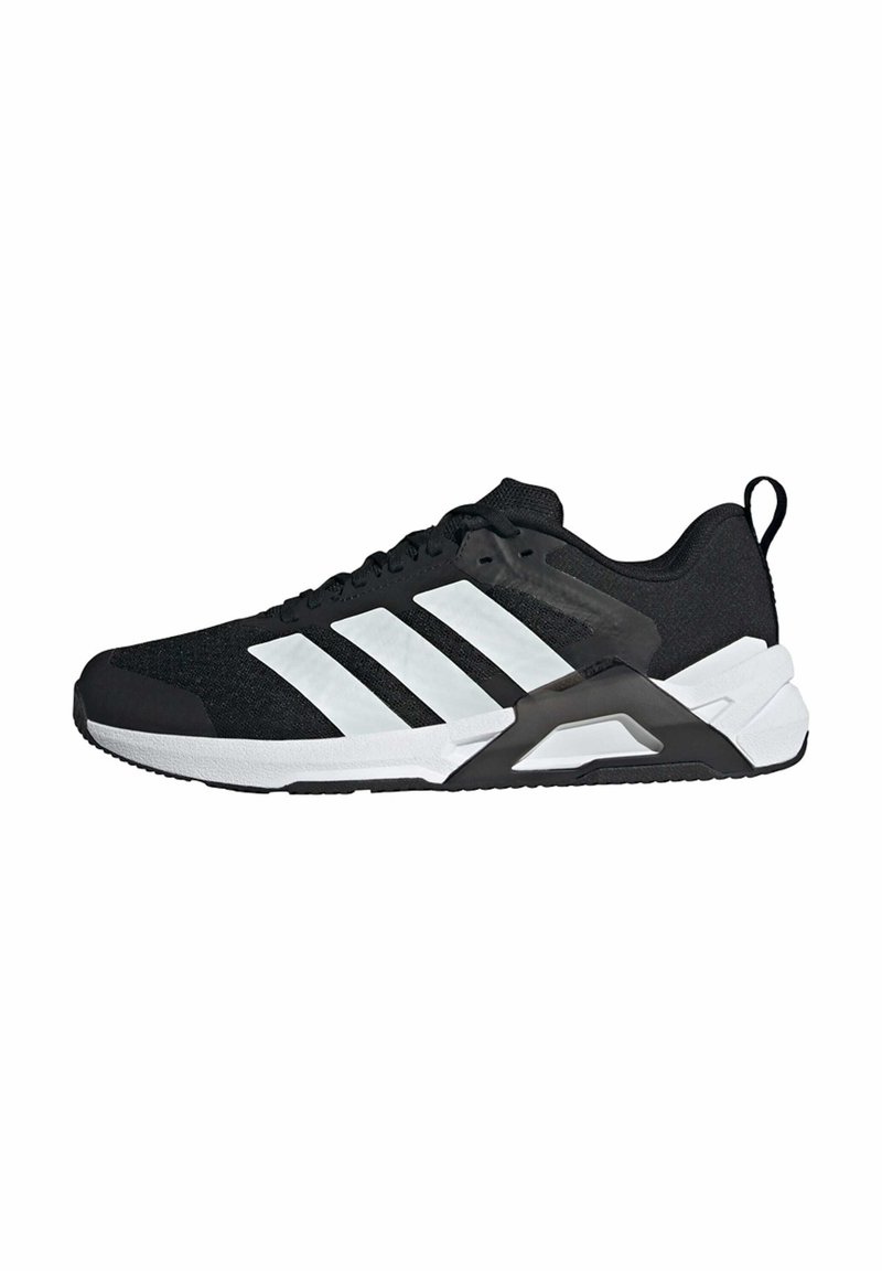 Black athletic shoe with textured fabric upper, white stripe accents, padded collar, and a black rubber sole with support frame.