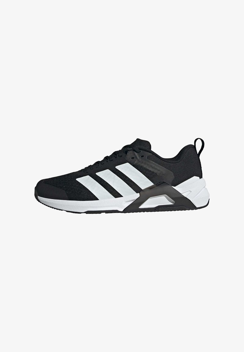 Black athletic shoe with textured fabric upper, white stripe accents, padded collar, and a black rubber sole with support frame.
