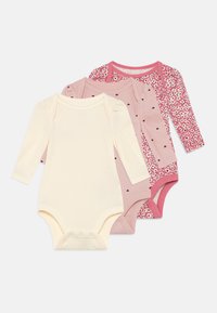 Conjunto de tres bodies de manga larga para bebés en crema, rosa y con estampados florales, que cuentan con broches a presión y una suave textura acanalada.