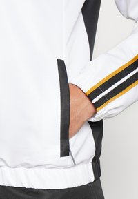 Sergio Tacchini LISTA TRACKSUIT - Survêtement - black/white/harvest gold