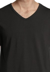 Black V-neck t-shirt made from soft, lightweight fabric. Features short sleeves and a relaxed fit for comfort.