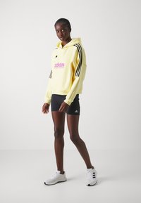 adidas Sportswear TIRO CUT 3 STRIPES HOODIE - Mikina s kapucňou - almost yellow melange/legend ink
