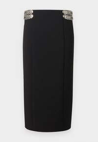 Μαύρη μίνι φούστα με ψηλή μέση, διακοσμημένη με ασημένια κυκλικά μεταλλικά διακοσμητικά και στις δύο πλευρές της ζώνης.