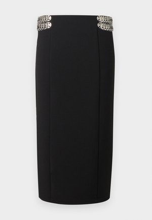 Fekete ceruzaszoknya magas derekú, ezüst színű kör alakú fém díszítésekkel a der�ékrész mindkét oldalán.