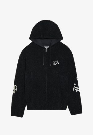 Sort lynlås hoodie lavet af tekstureret fleece. Har en hætte med snoretræk og broderede detaljer, herunder "LA" på brystet og et design på ærmerne.