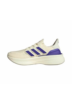 Cream-colored running shoe with purple stripes and heel support, textured sole, and lace-up closure, side view on white background.