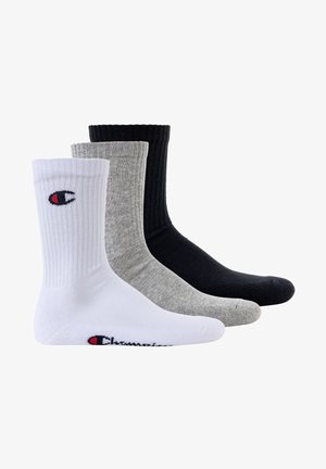 Tre paia di calze: bianche, grigie e nere. Texture a coste con un logo sul lato. Materiale in cotone, altezza media e finitura liscia.