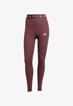 Bordo tajice s prilagođenim dizajnom. Imaju široku elastiku s „TECHFIT“ oznakom i tri bijele pruge na strani. Glatka tekstura.