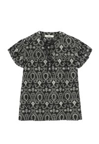 Blouse noire présentant un motif paisley et floral blanc, avec des manches courtes à volants, un col arrondi et un petit détail de nœud sur le devant.