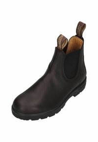 Brauner Leder-Stiefelette mit elastischen Seitenteilen, abgerundeter Spitze und strukturierter Gummisohle. Verfügt über Zugschlaufen für einfaches Anziehen.