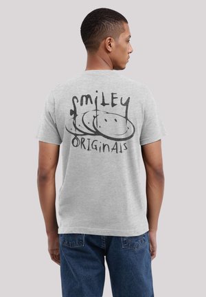 Gray cotton t-shirt featuring a black graphic on the back with the text "smiley" and "ORIGINaIS," surrounded by a circular design.