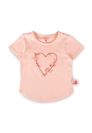 Light pink short-sleeve toddler shirt with a floral heart outline embroidered in orange on the front and a small fabric heart tag on the side.