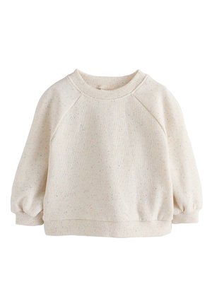 Sweat-shirt couleur crème avec un motif tacheté. Comprend un col ras du cou côtelé, des manches raglan et des poignets élastiques. Texture douce.