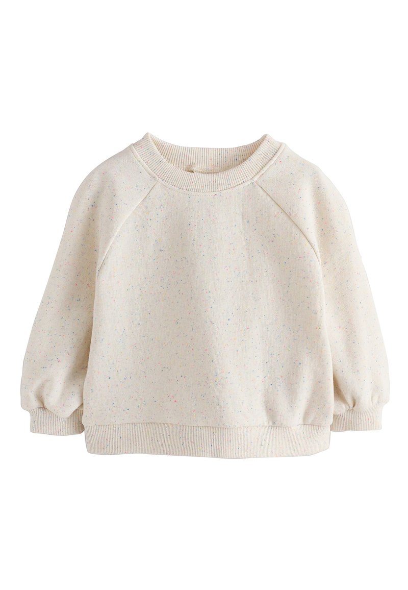 Sweat-shirt couleur crème avec un motif tacheté. Comprend un col ras du cou côtelé, des manches raglan et des poignets élastiques. Texture douce.