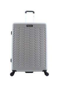 Hartschalentrolley in Silber mit strukturiertem, hexagonalem Muster. Mit einem ausziehbaren Griff und vier schwarzen Drehrollen für die Mobilität ausgestattet.