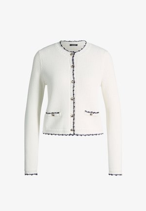 White textured knit cardigan with long sleeves, silver buttons, two front pockets, and navy trim along edges and pockets.