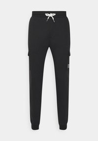 Svarta sweatpants gjorda av mjukt tyg, med dragsko i midjan, sidofickor i cargo-stil och avsmalnande ben med ribbade muddar.