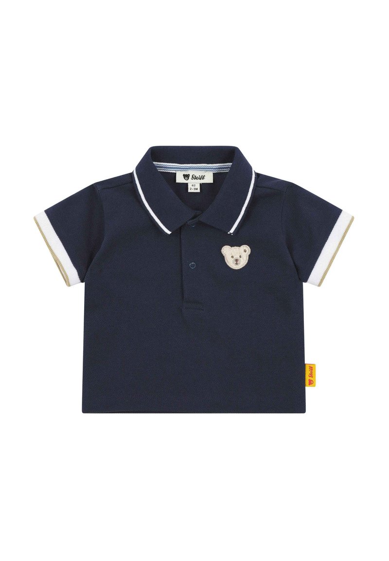 Polo shirt blu navy con maniche corte, dettagli a righe bianche e logo di un orso sul petto. Realizzato in tessuto strutturato con colletto abbottonato.