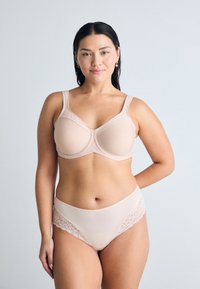 Beige bra with adjustable straps and seamless cups, paired with matching high-waisted panties featuring lace accents along the edges.