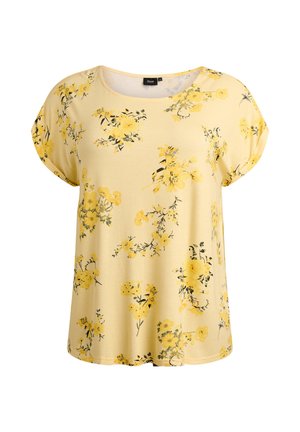 Žlutý krátký top s květinovým motivem z měkké látky. Má kulatý výstřih a roztroušené žluté a černé květinové vzory po celé ploše.