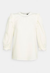 Blusa bianca con maniche lunghe e svasate, caratterizzata da dettagli arricciati sulle spalle e sui polsini, e un collo rotondo. Tessuto morbido e leggero.