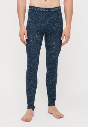 Marineblaue Leggings mit einem komplizierten Musterdesign, ausgestattet mit einem weichen Bund, der mit "BJÖRN BORG" beschriftet ist, sowie einem glatten, dehnbaren Stoff.